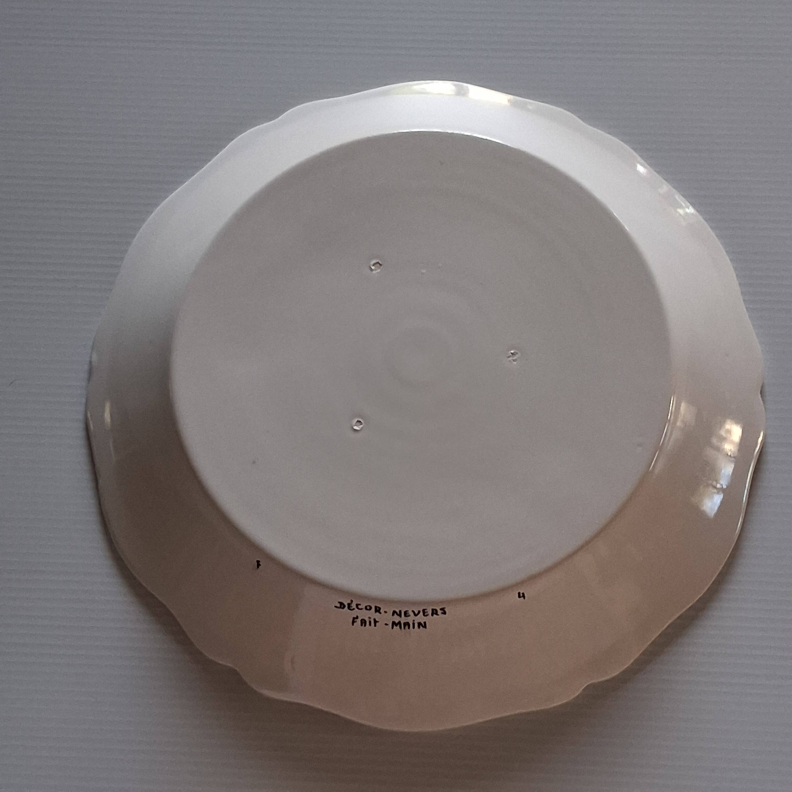 Slightly hollow dish with wavy edge in very good condition from Nevers.