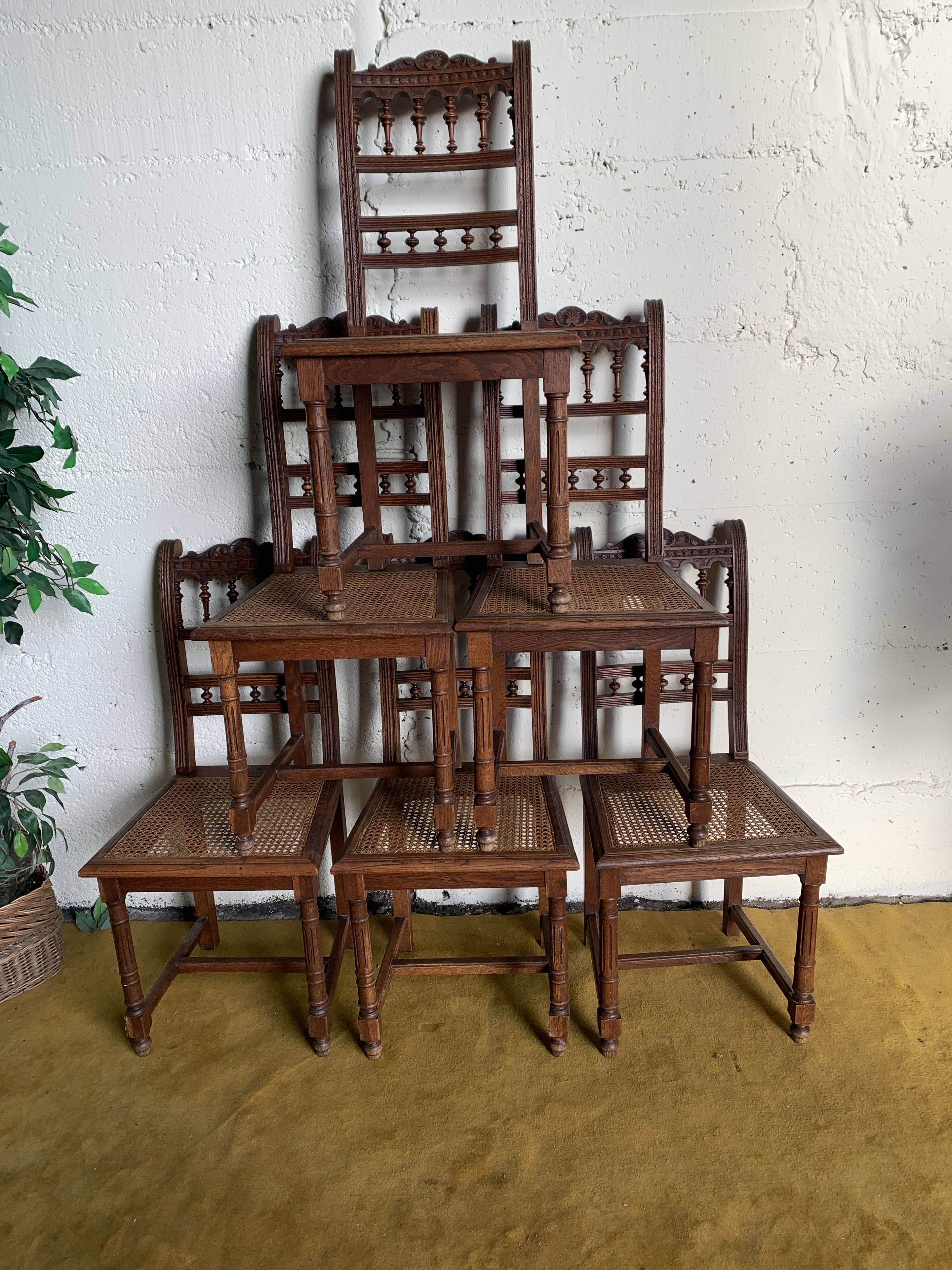 6 carved wooden chairs with cane seats