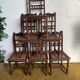 6 carved wooden chairs with cane seats