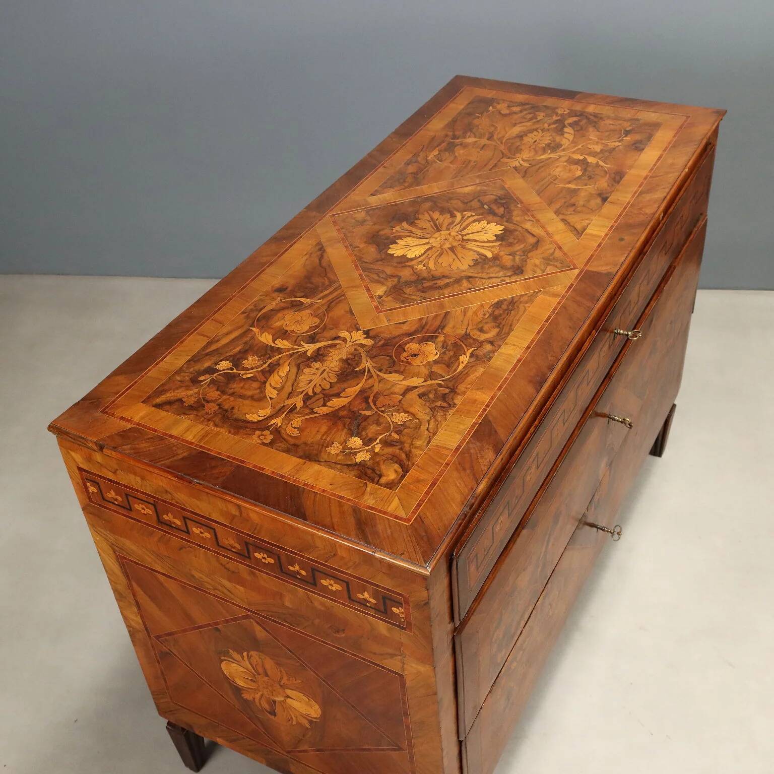 Pair of antique neoclassical walnut commodes from the 18th century.