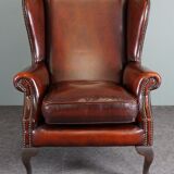 Leather armchair with decorative nails