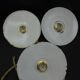 Trio of enamelled sheet metal hanging lamps
