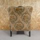 Old armchair upholstered in velvet, carved and caned wood