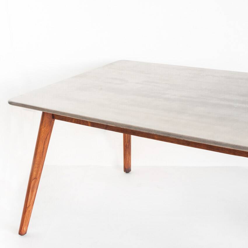 Scandinavian style dining table. Polished and varnished wood and concrete. For indoor or outdoor use.