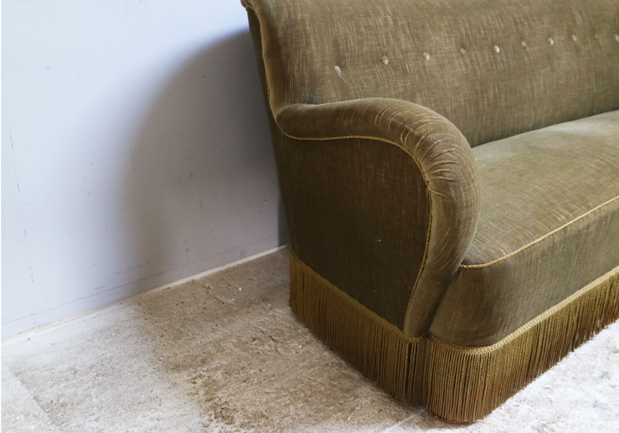 1930’s Danish sofa in green velour with fringed bottom