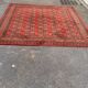 Tapis persan en laine rouge bordeaux Louis de Poortere 250x350cm