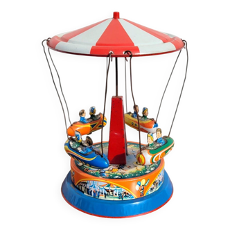 Old tin carousel toy