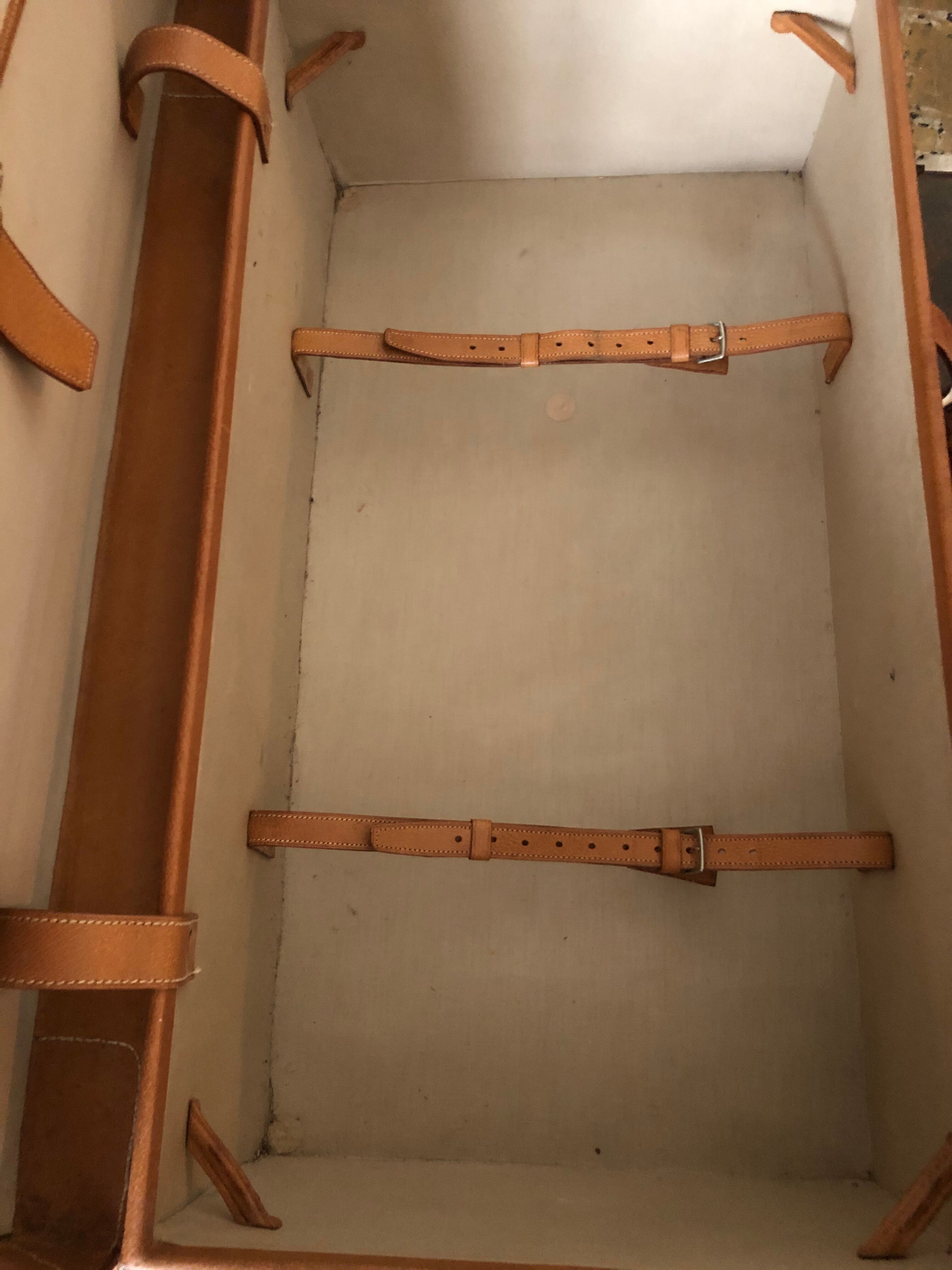 Former leather trunk with Louis Vuitton label holder