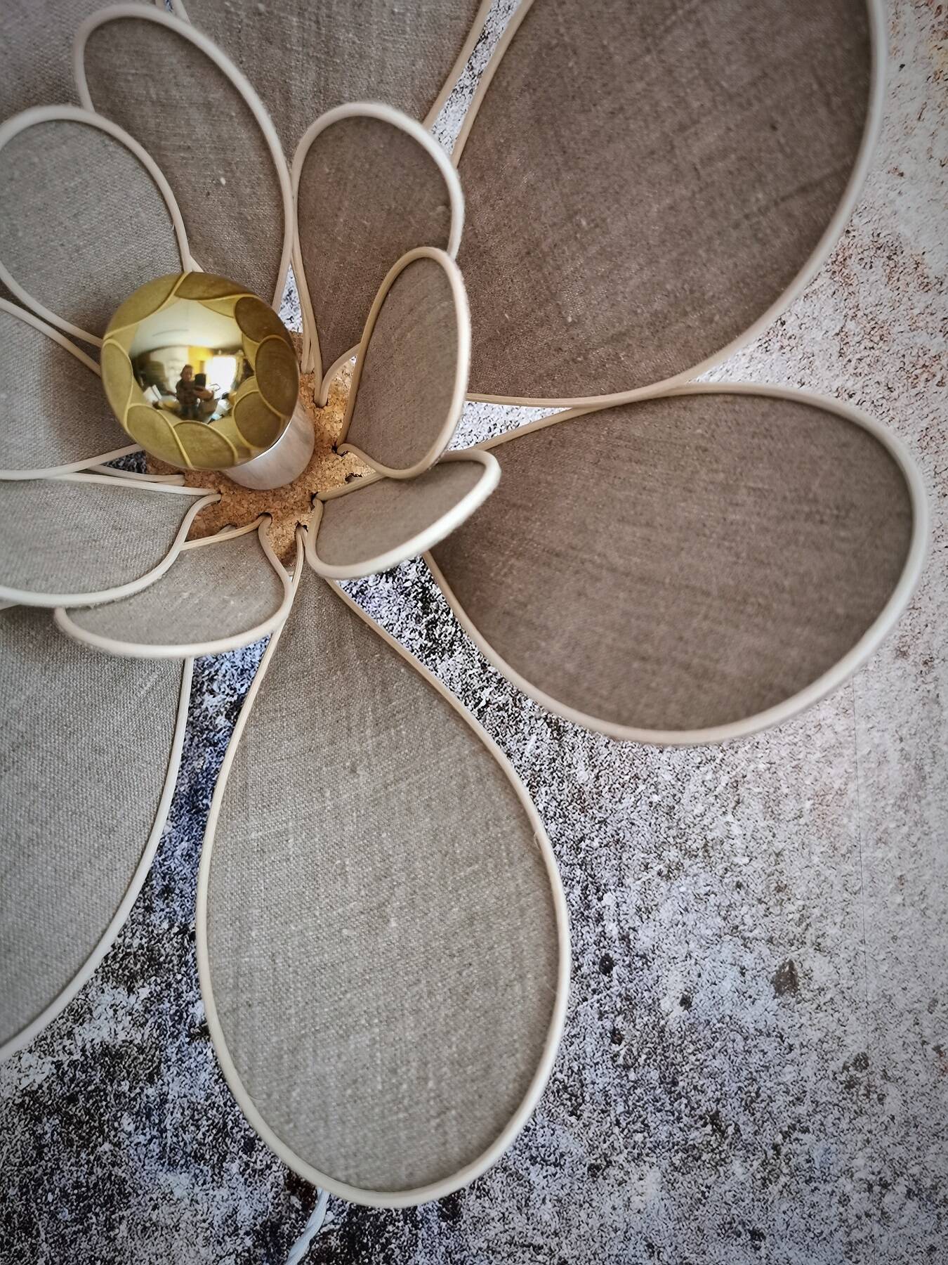 Flower wall light made of rattan and natural linen petals