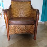Woven rattan armchair and exotic wood in colonial style, 1980s.