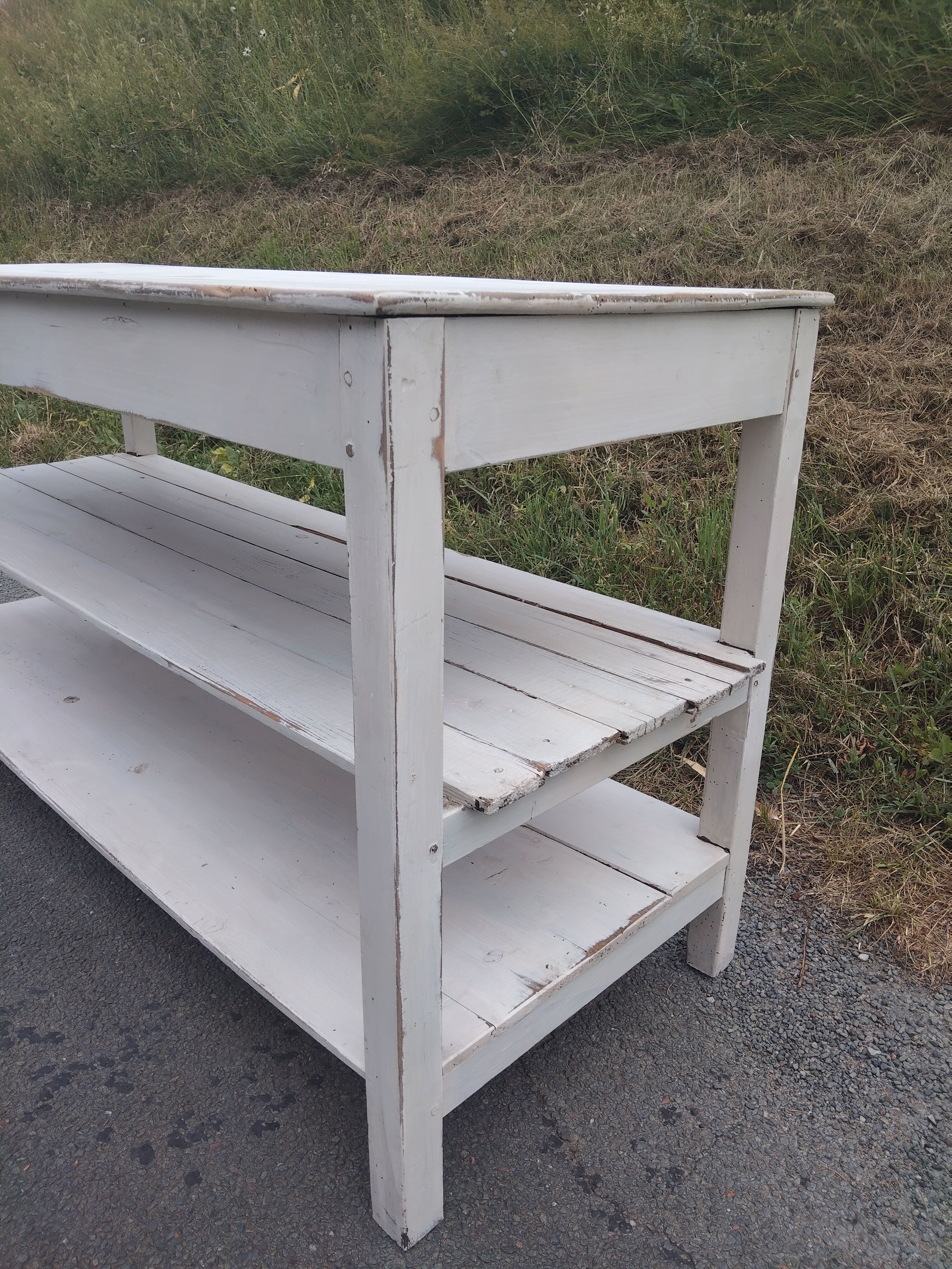 Antique white patinated draper's table, florist's wooden console.