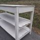 Antique white patinated draper's table, florist's wooden console.