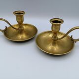 Pair of brass hand candlesticks