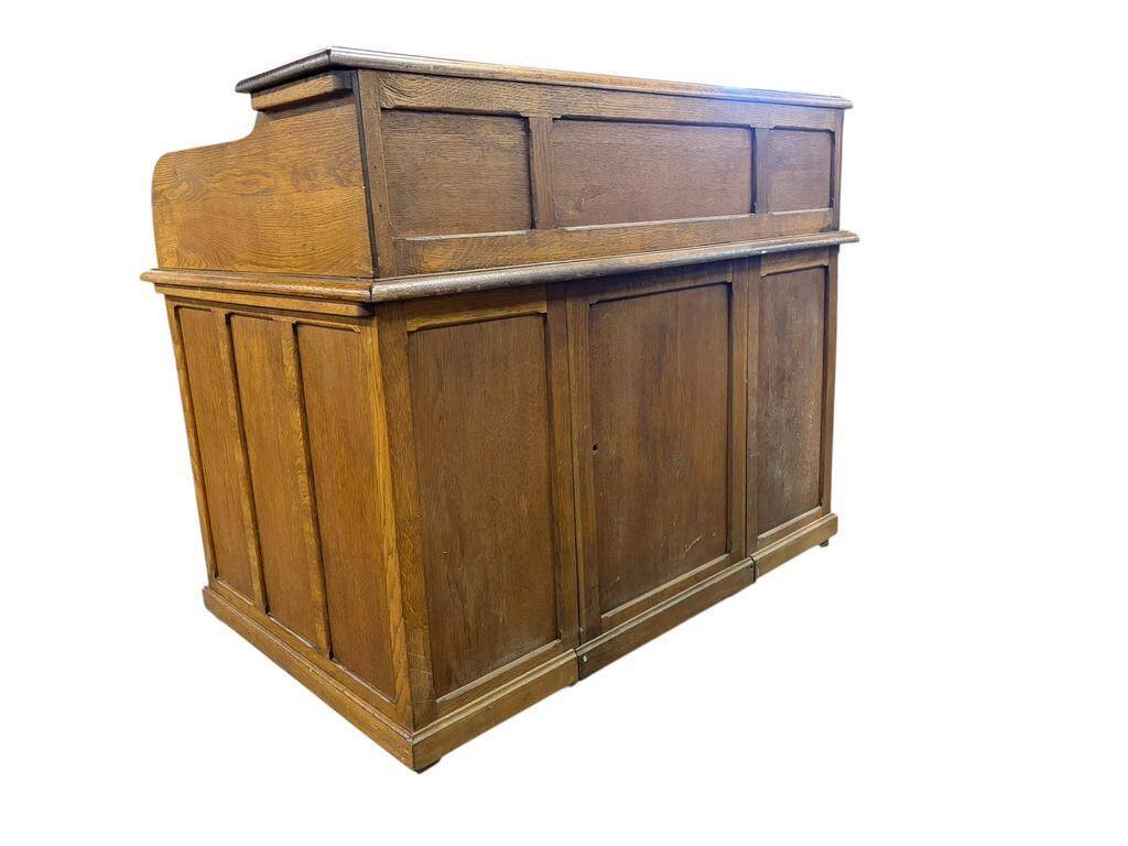 Vintage American desk made of solid wood with a curtain.