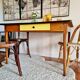Old wooden farmhouse table and yellow formica top