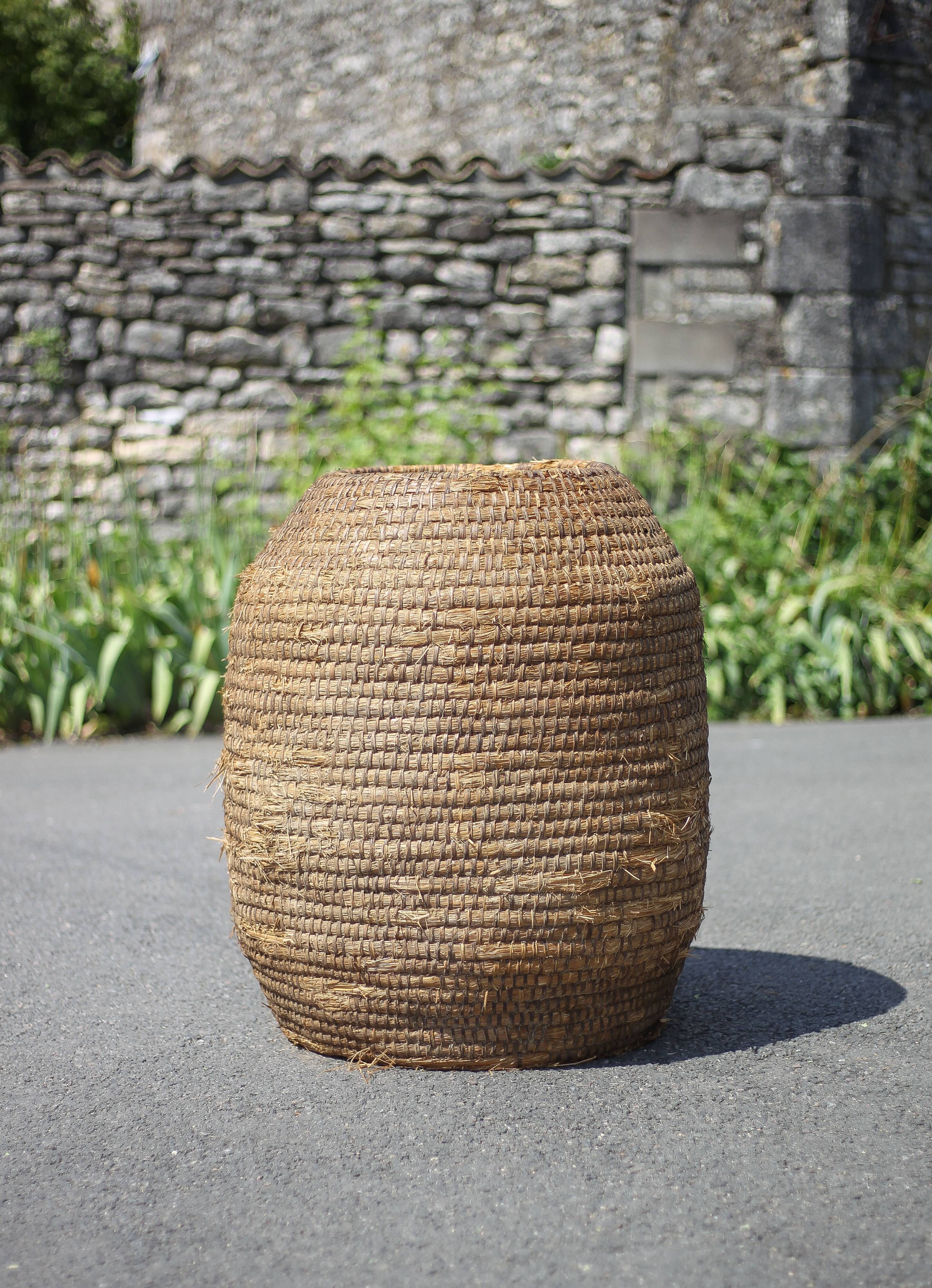 Very large old basket, burgundy straw and bramble, woven basket