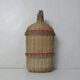 Ancient pilgrim's gourd in rattan lourdes