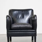 Luxurious and comfortable sheepskin armchair in a unique, stately black color
