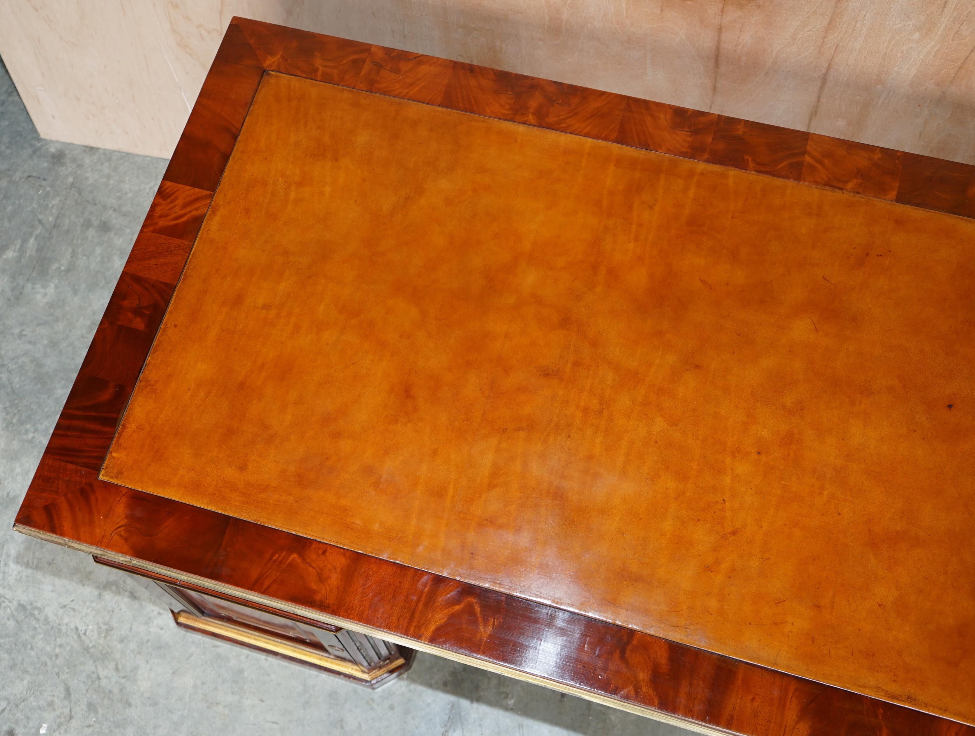 Restored antique Russian hardwood partner desk and leather armchair.