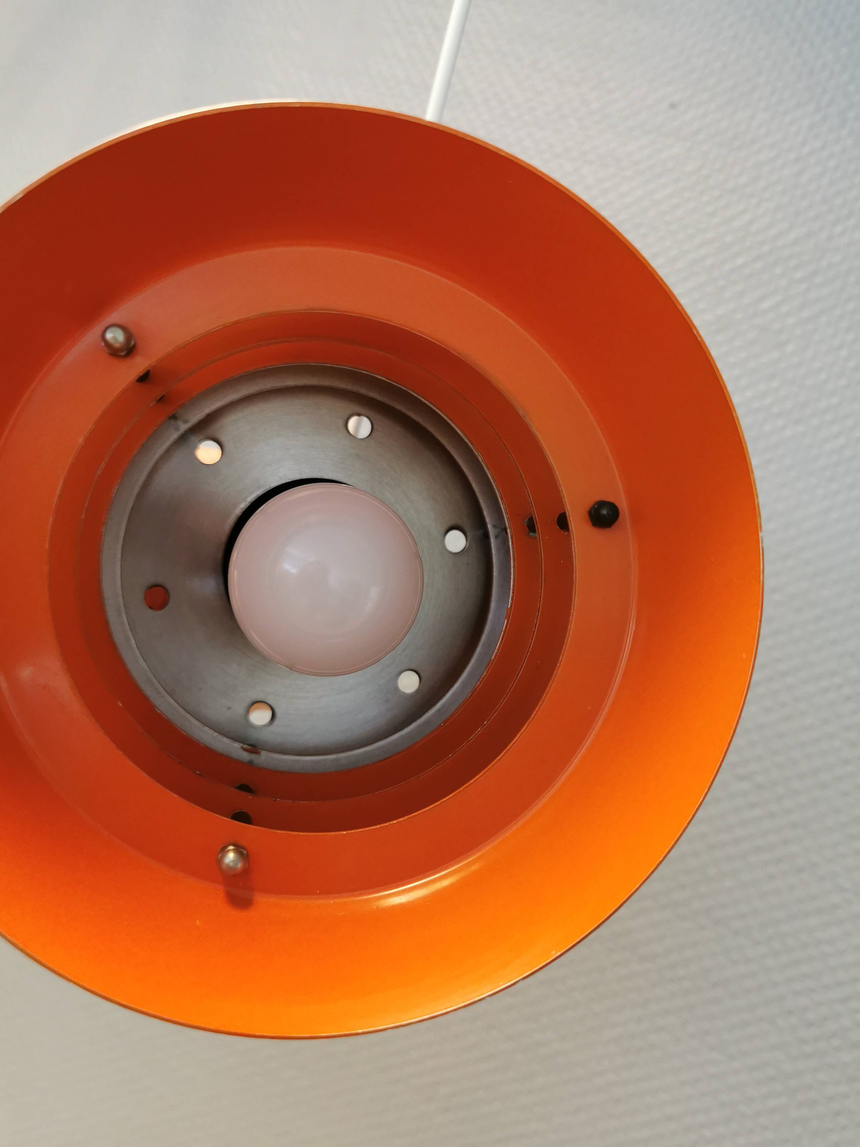 Danish/Swedish hanging lamp, in silver-coloured aluminium with orange interior paint.