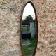 Vintage hanging oval mirror in teak Italian design
