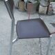 Vintage chrome metal chair and faux black leather