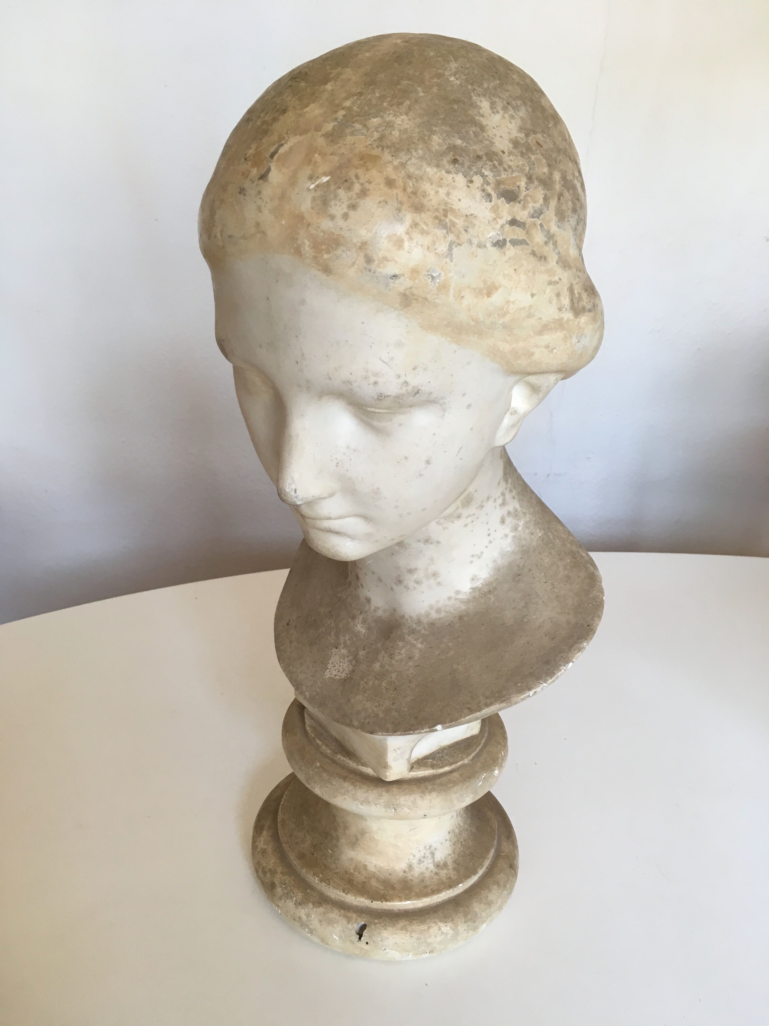 Former girl bust end 19th in plaster cast on its base
