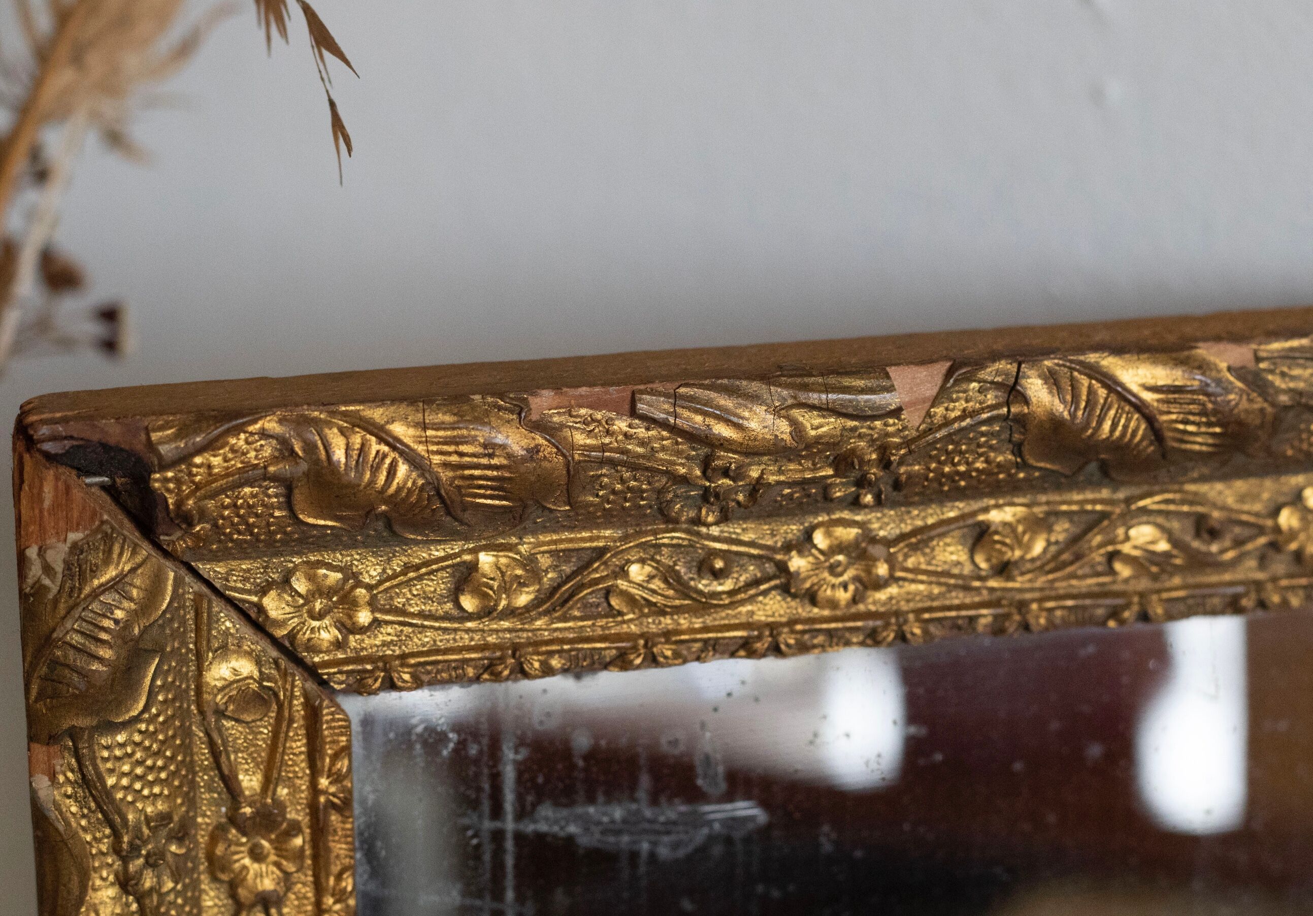 Antique mirror in gilded wood