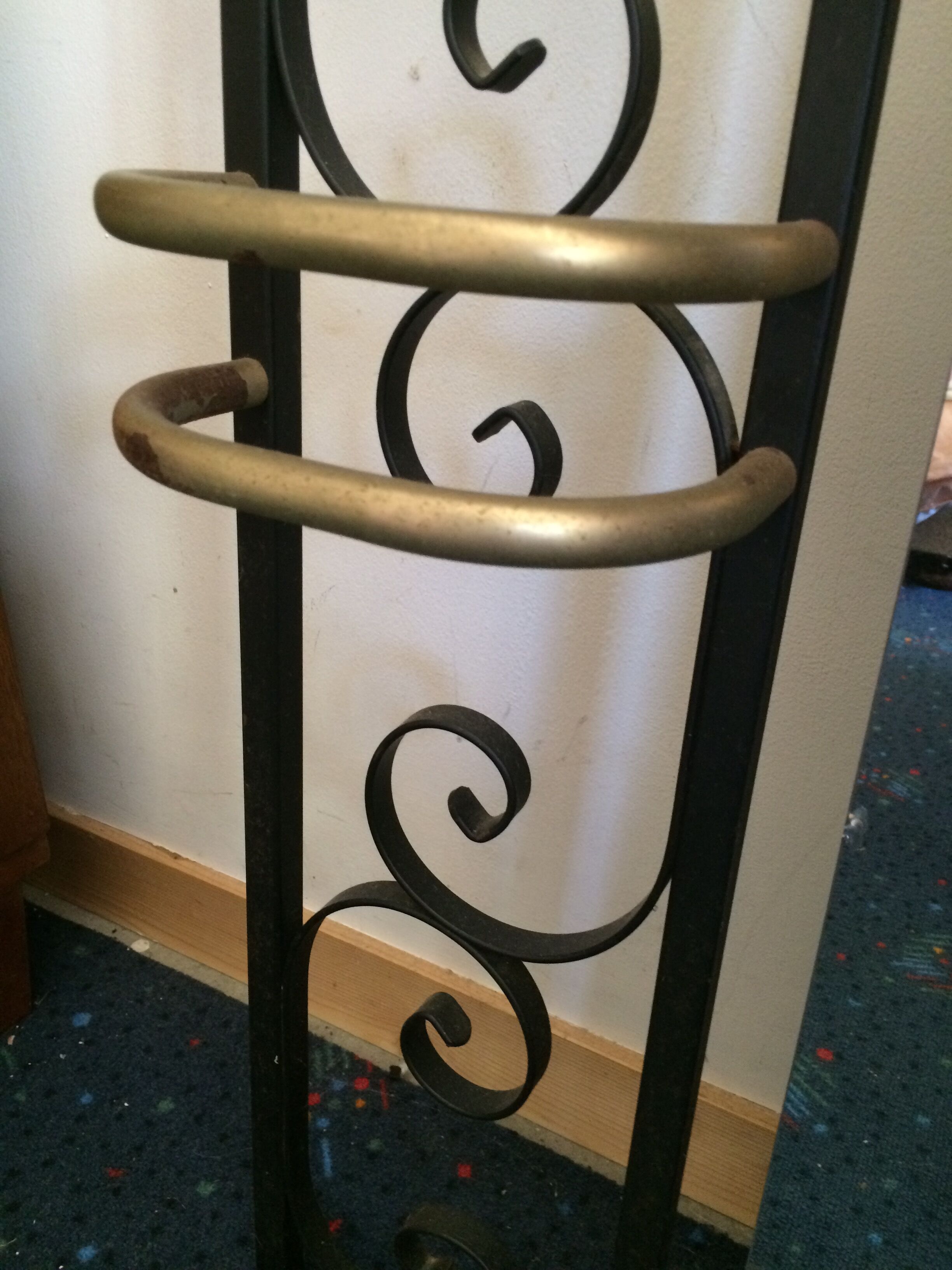 Coat hanger on wrought iron feet
