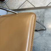 1 Linda armchair chair by Arrben in camel brown leather with a chrome steel frame.