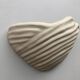 Shell-shaped ceramic applique handcrafted.