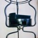 Foldable wrought iron support from the 19th century for a toilet set.