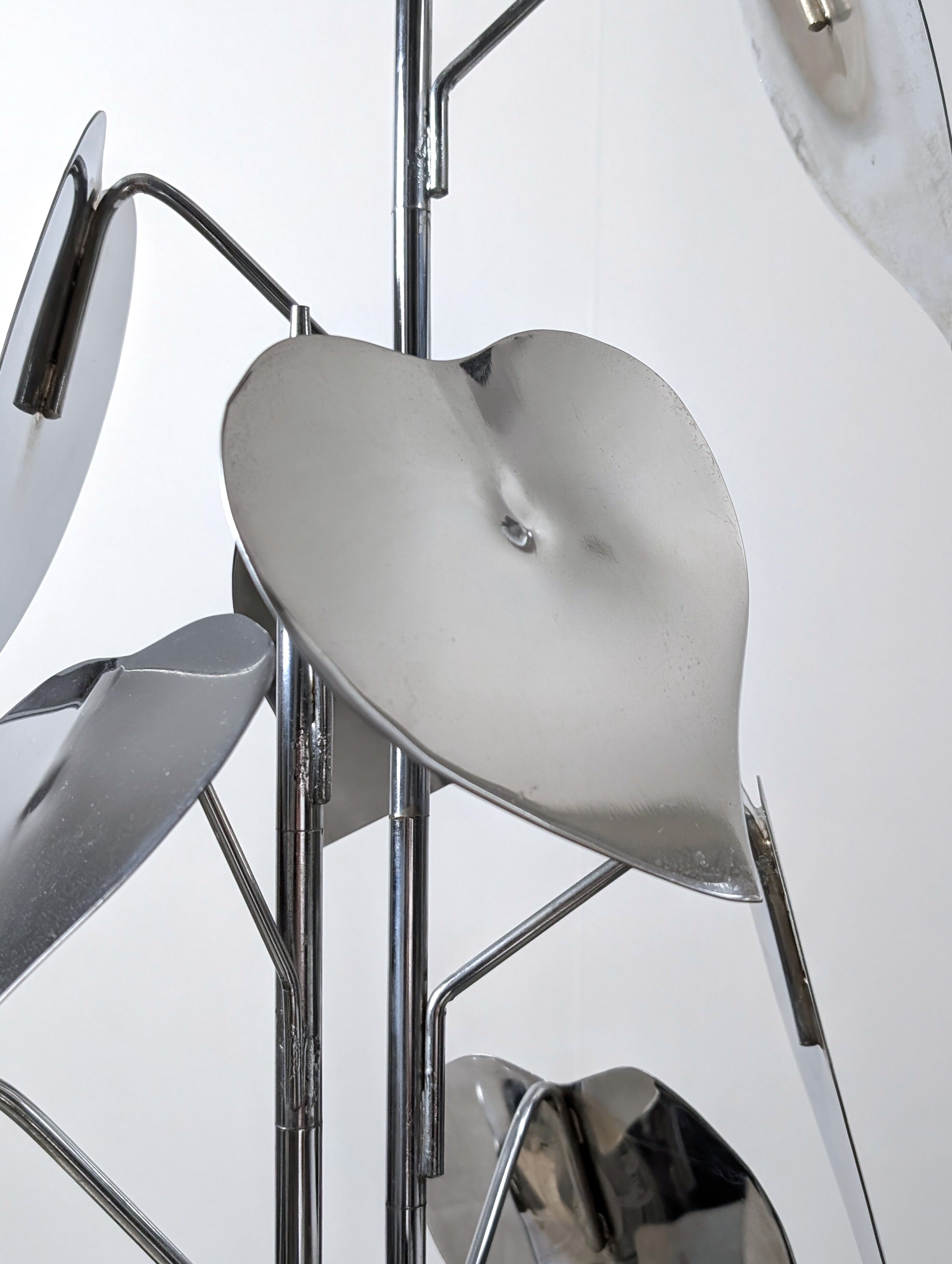 Standing sculpture with chrome leaves and circular base, 1970s