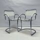 Vintage tubular frame chairs with white skai