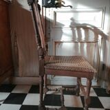 Chair with a decoration of foliage and bunches of grapes