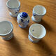 Set of 4 vintage egg cups and salt shaker in blue Delft pottery.