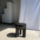 Black mango wood tripod side table with a semi-spherical top, height: 45 cm, diameter: 44 cm.