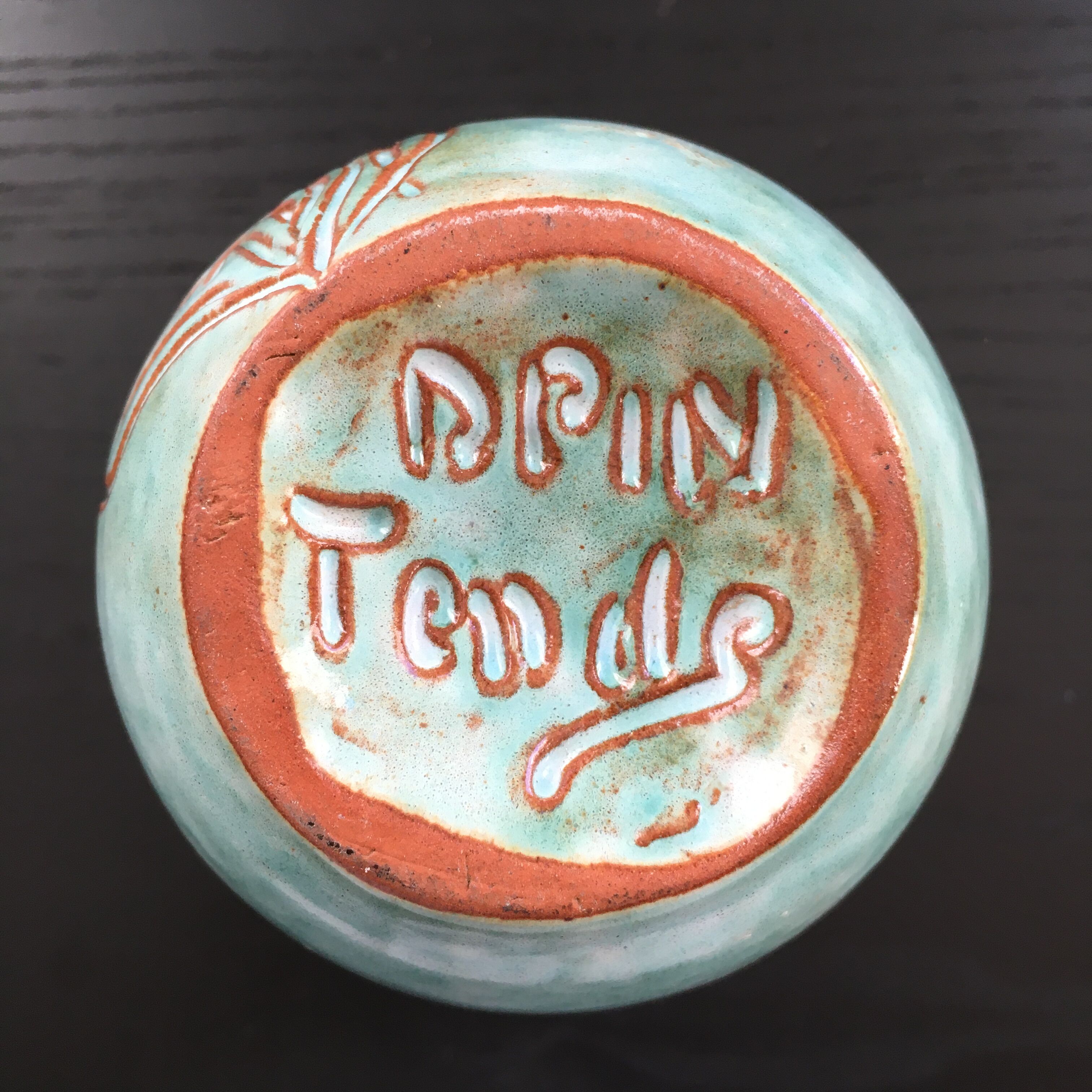 Turquoise vase with iris decoration