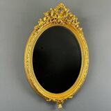 Miroir ovale doré style Louis XVI, XIXe siècle
