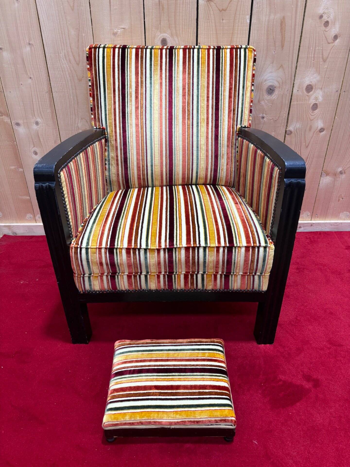 Art Deco armchair in multicolored striped fabric and its footrest