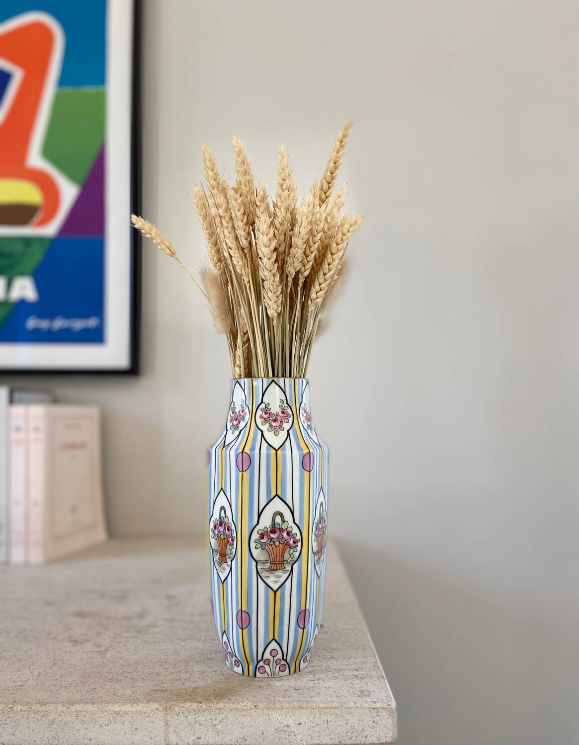 Striped ceramic vase with flowers