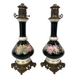 Pair of electrically mounted kerosene lamps, porcelain decorated with roses