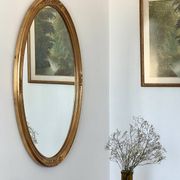 Oval mirror in carved wood