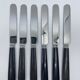 Set of 6 round-tipped dessert knives with dark wood, Nilox blade.