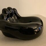 Black ceramic ashtray left hand