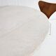 Round dining table in travertine from the 1980s.