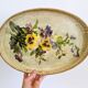 Oval metal decorative vintage tray with floral pattern.