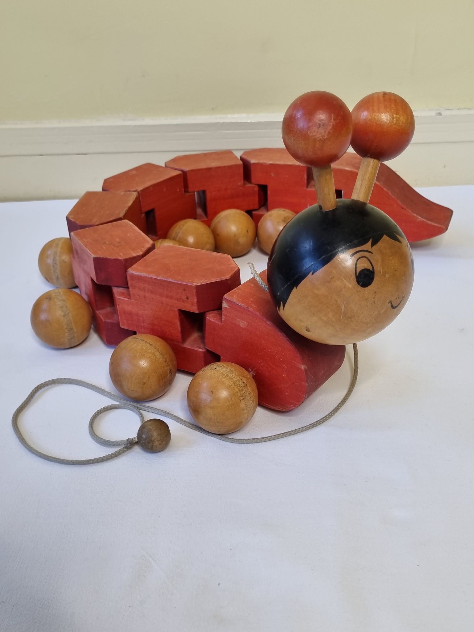 Vintage pulling toy, "centipede", 82 cm, made in Switzerland