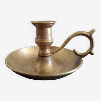 Old gilded brass candle holder with handle