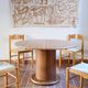 Round table with a central pedestal, light wood, 1990s.